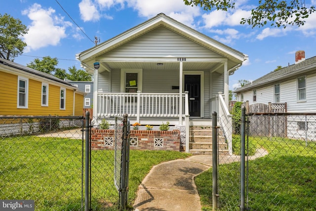 bungalow-style house featuring a porch and a front yard