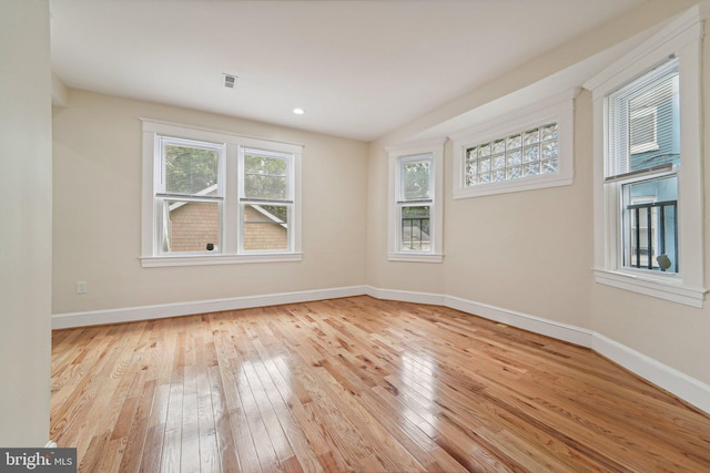 unfurnished room featuring light wood-type flooring