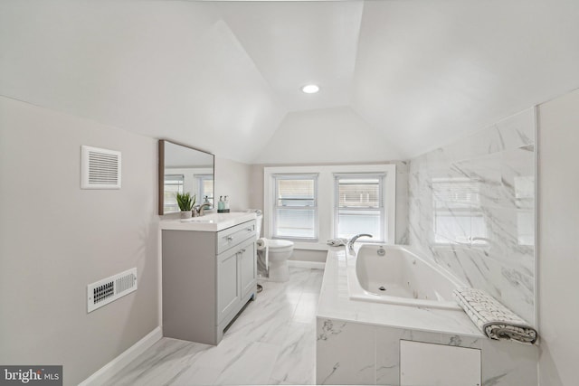 bathroom with lofted ceiling, toilet, vanity, and tiled tub