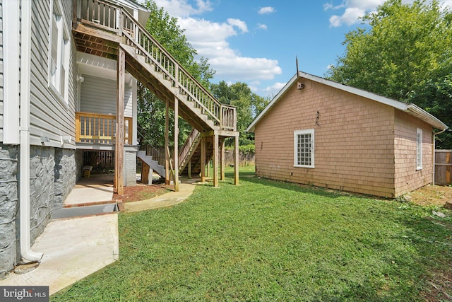 view of yard with a deck