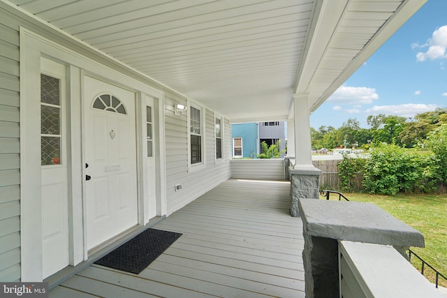 wooden deck featuring covered porch