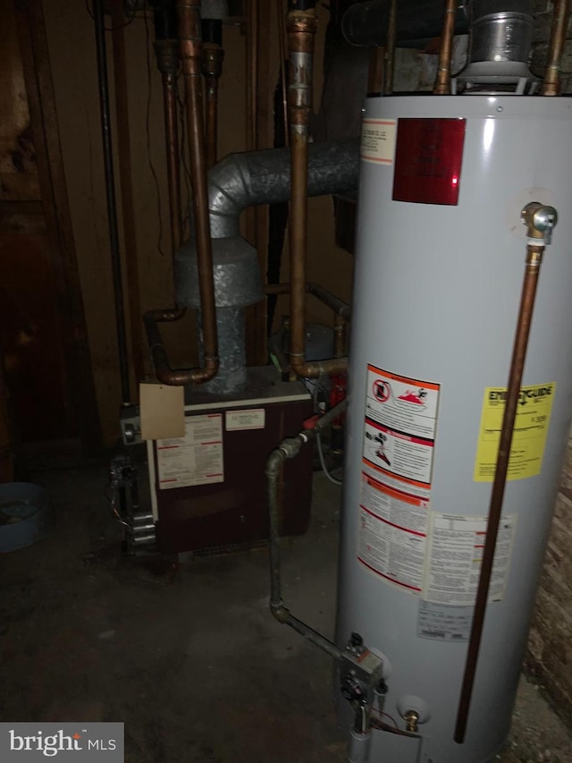 utility room featuring gas water heater