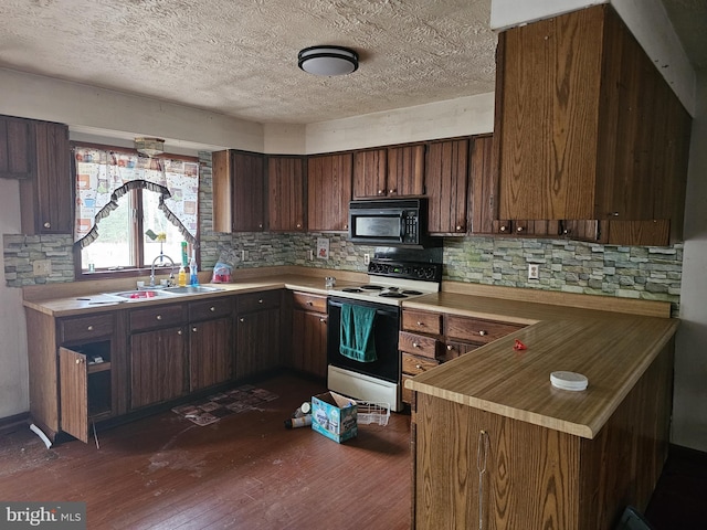 kitchen with white range with electric stovetop, dark hardwood / wood-style flooring, dark brown cabinets, and sink