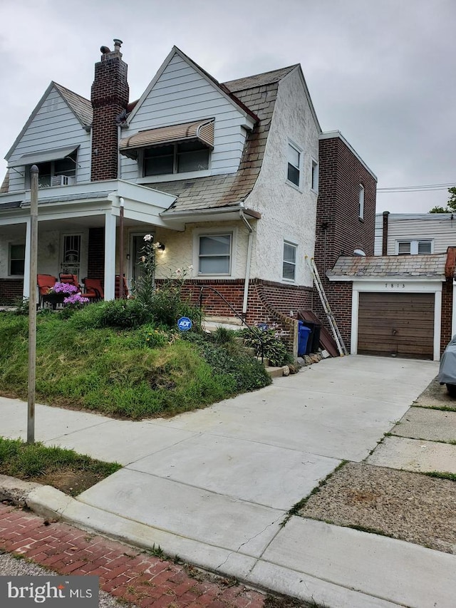 view of front of house featuring a garage and covered porch