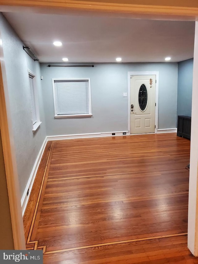 foyer with wood-type flooring