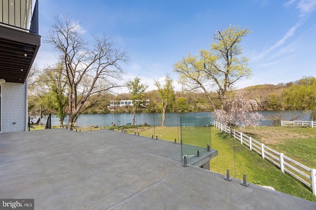 view of patio with a water view