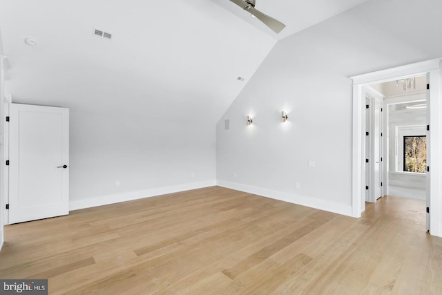 additional living space featuring light hardwood / wood-style flooring, vaulted ceiling, and ceiling fan