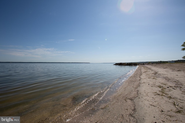 property view of water featuring a beach view