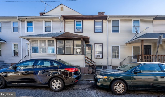 townhome / multi-family property with a sunroom