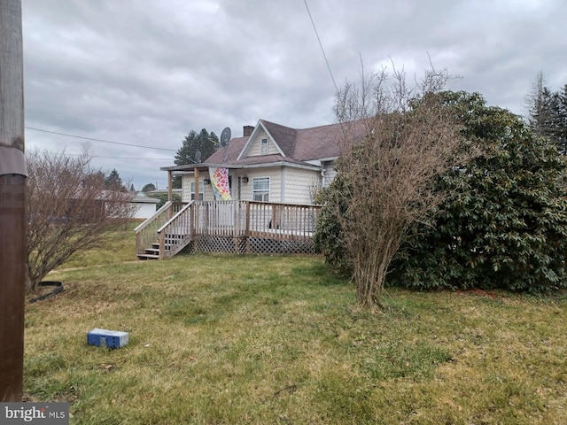 exterior space with a front yard and a deck