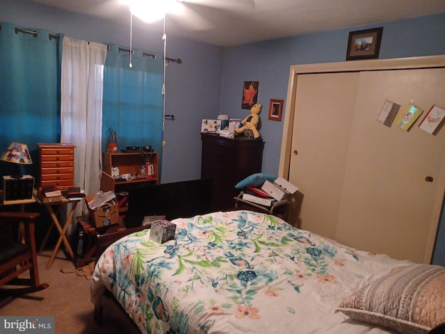 carpeted bedroom featuring ceiling fan