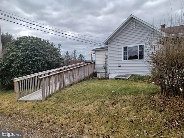 view of home's exterior featuring a yard