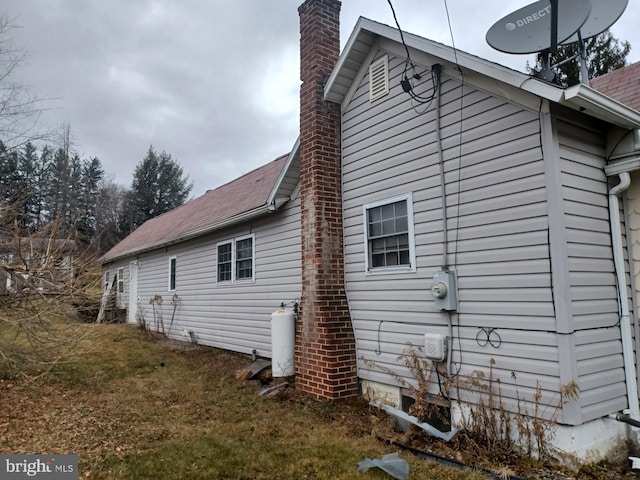 view of home's exterior featuring a yard