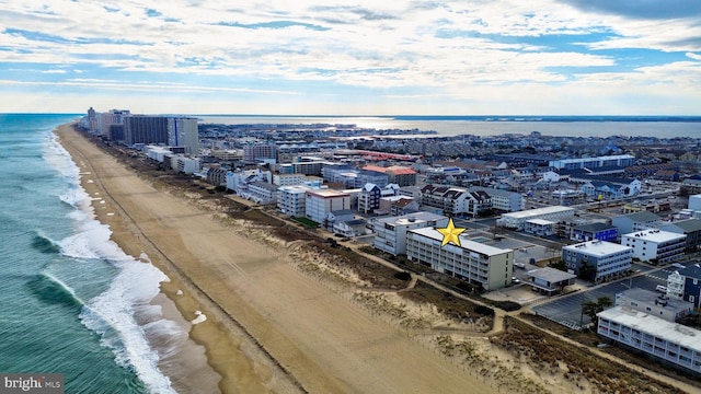 aerial view with a view of the beach and a water view