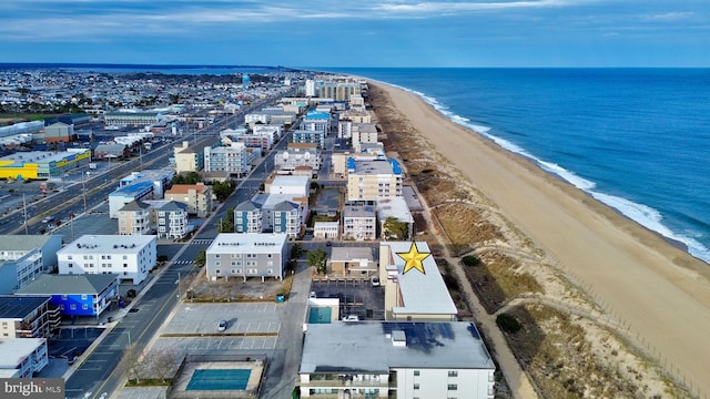 bird's eye view featuring a view of the beach and a water view