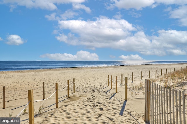 property view of water featuring a view of the beach