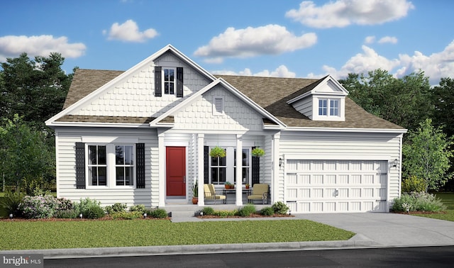 view of front of house with a garage and a front lawn