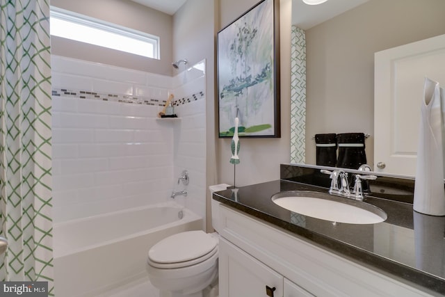 full bathroom with shower / bath combo with shower curtain, vanity, and toilet