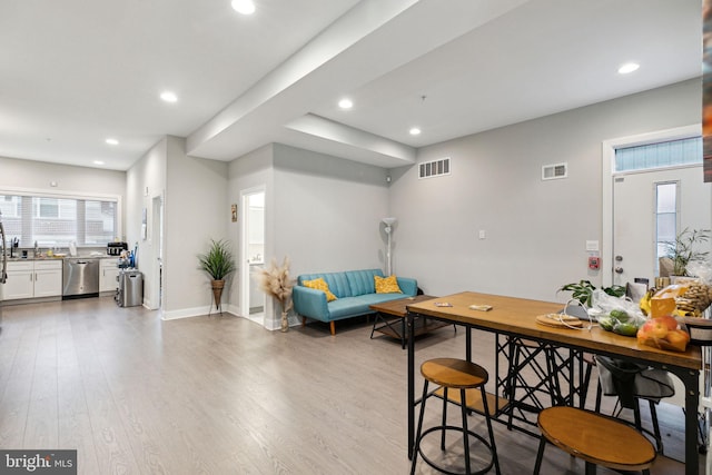 dining room with light wood-type flooring