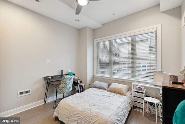 bedroom featuring ceiling fan and dark hardwood / wood-style floors