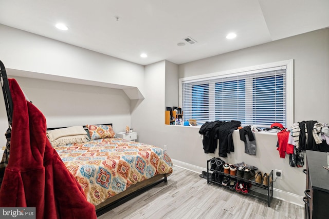 bedroom with light wood-type flooring