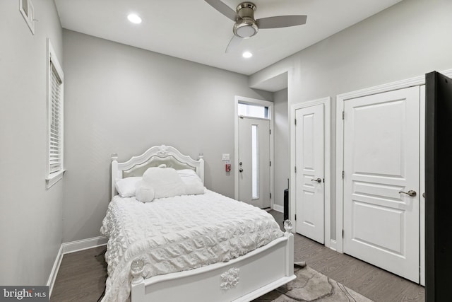 bedroom featuring hardwood / wood-style flooring and ceiling fan