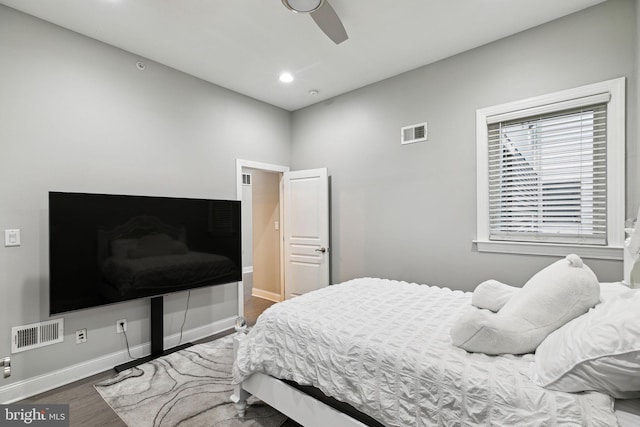 bedroom with hardwood / wood-style flooring and ceiling fan