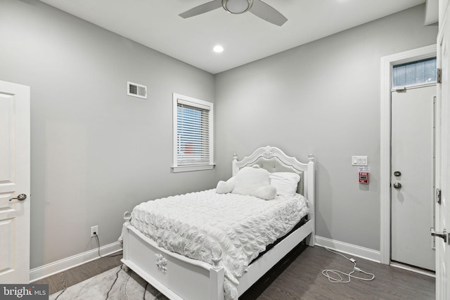 bedroom featuring dark hardwood / wood-style flooring and ceiling fan