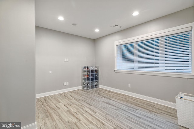 spare room featuring light hardwood / wood-style flooring