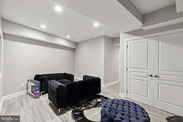 living area with light hardwood / wood-style flooring