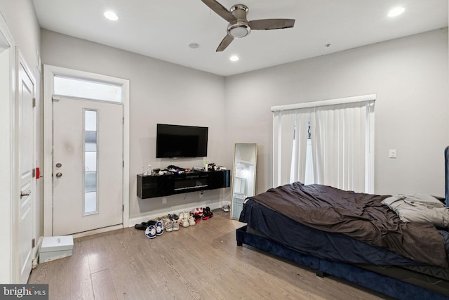 bedroom featuring wood-type flooring and ceiling fan