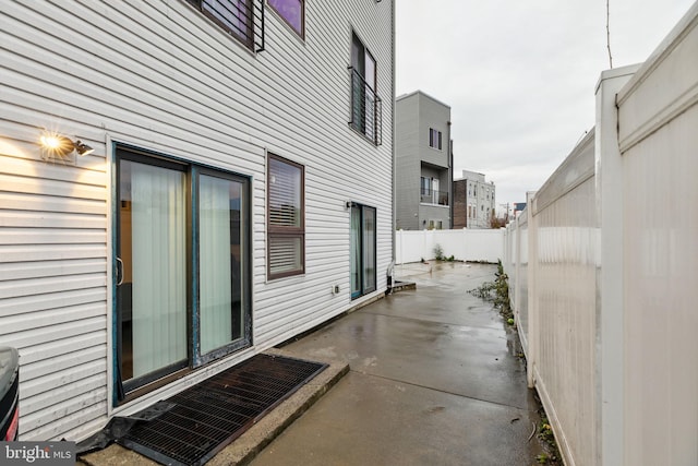 view of side of property with a patio area