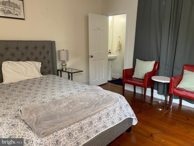 bedroom featuring dark hardwood / wood-style flooring