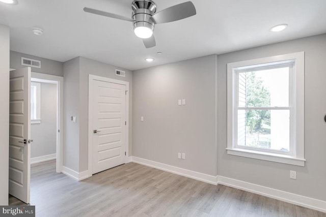 interior space with a closet, light hardwood / wood-style floors, and ceiling fan