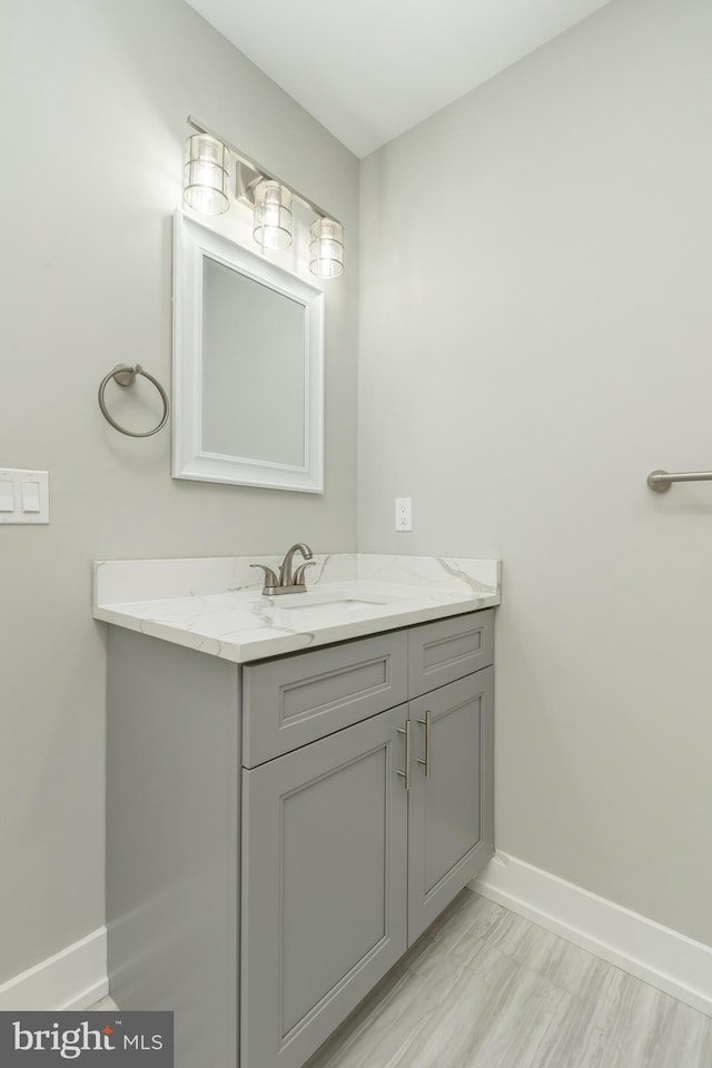 bathroom with vanity and hardwood / wood-style flooring