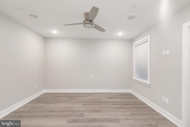 unfurnished room with ceiling fan and light wood-type flooring