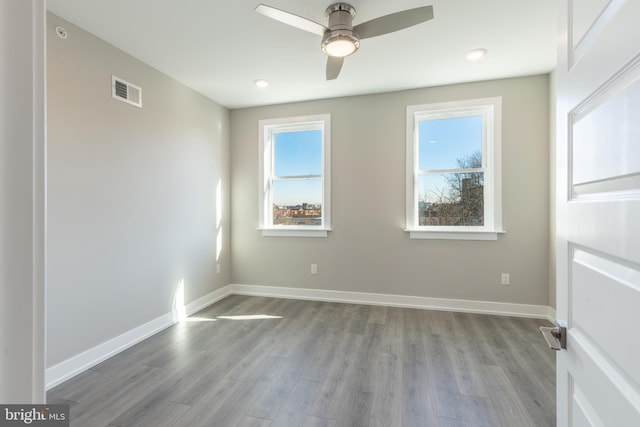 unfurnished room featuring light hardwood / wood-style flooring and ceiling fan