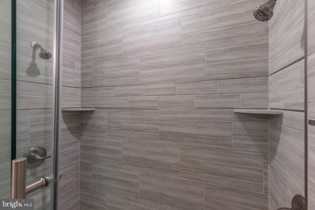 bathroom with tiled shower