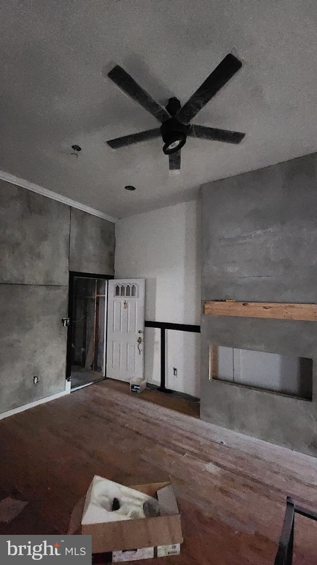 spare room with hardwood / wood-style floors and ceiling fan