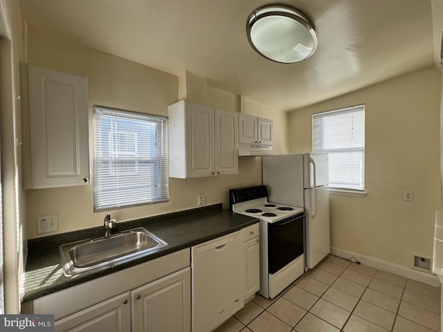 kitchen with plenty of natural light, white cabinetry, white appliances, and sink