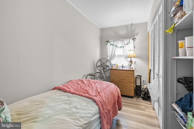 bedroom with light hardwood / wood-style flooring