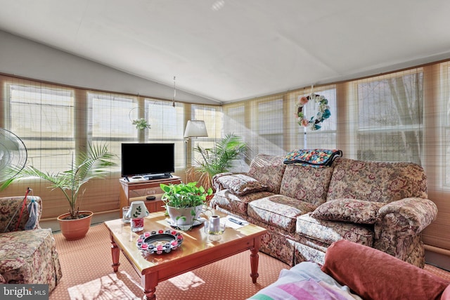 carpeted living room with vaulted ceiling