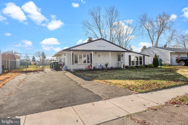 view of front of property featuring a front lawn and covered porch