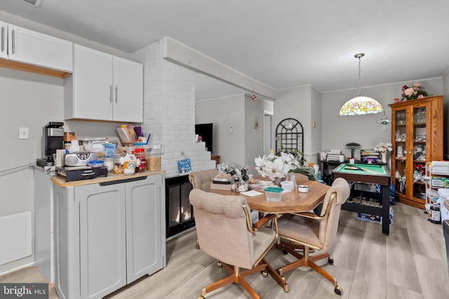 dining room featuring light hardwood / wood-style floors and billiards