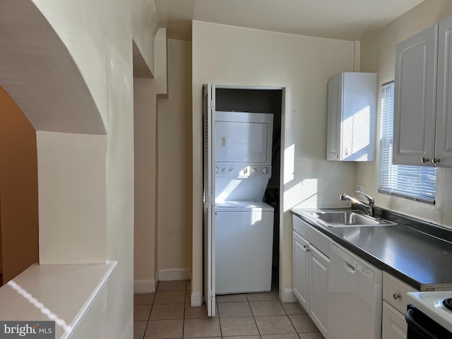 1819 D St NE Unit 1, 2, 3 & 4, Washington, DC 20002 - laundry room with stacked washer / drying machine, healthy amount of natural light, and light tile patterned floors