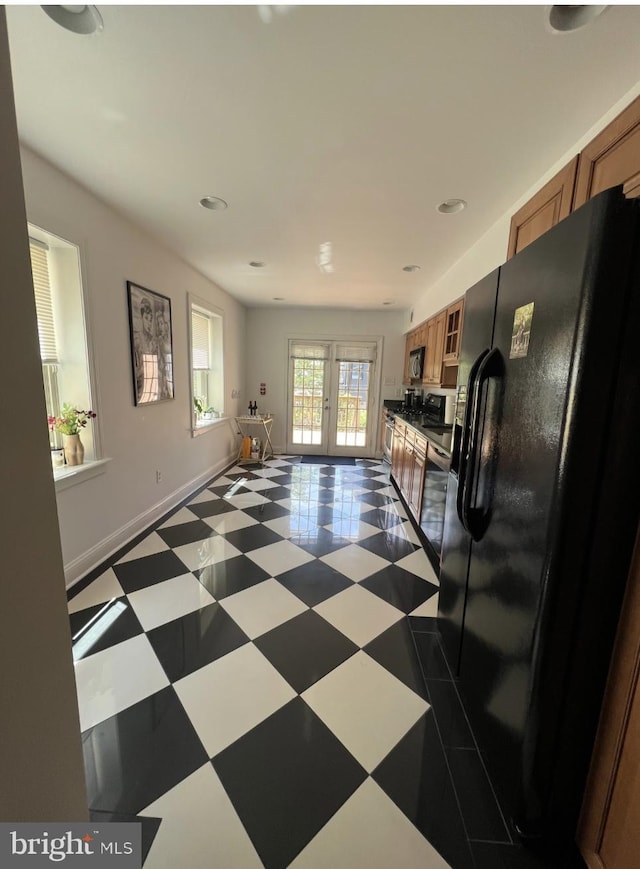 2022 Fitzwater St, Philadelphia, PA 19146 - kitchen featuring black refrigerator with ice dispenser, brown cabinetry, french doors, glass insert cabinets, and recessed lighting
