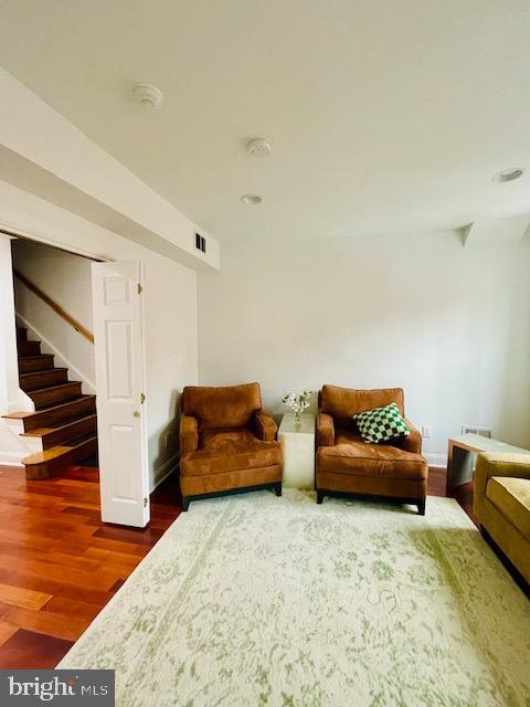 sitting room with dark hardwood / wood-style floors