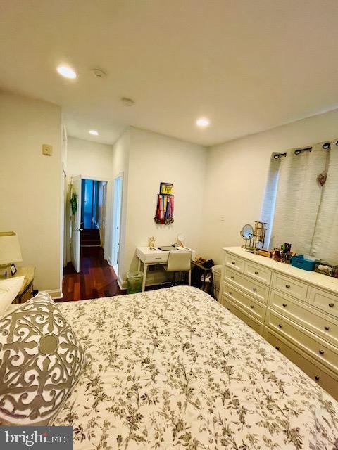 unfurnished bedroom featuring dark hardwood / wood-style flooring