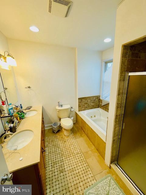 2022 Fitzwater St, Philadelphia, PA 19146 - bathroom with double vanity, a stall shower, a garden tub, tile patterned flooring, and recessed lighting