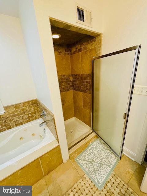 2022 Fitzwater St, Philadelphia, PA 19146 - bathroom with a stall shower, a whirlpool tub, and tile patterned flooring